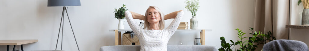 A woman relaxing in her cool home