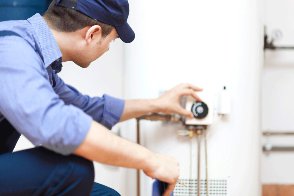 Plumber repairing a water heater