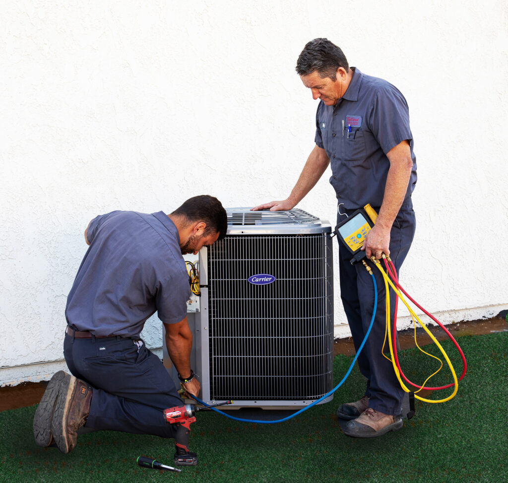 HVAC techs performing an AC tune-up at a San Bernardino home