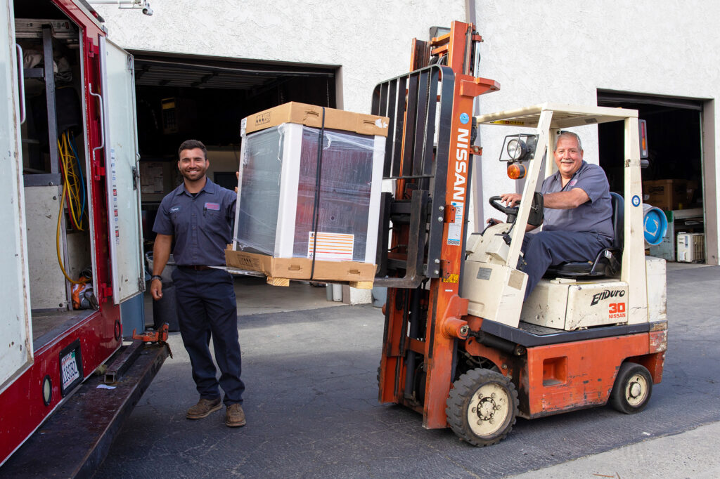 HVAC techs with a new furnace